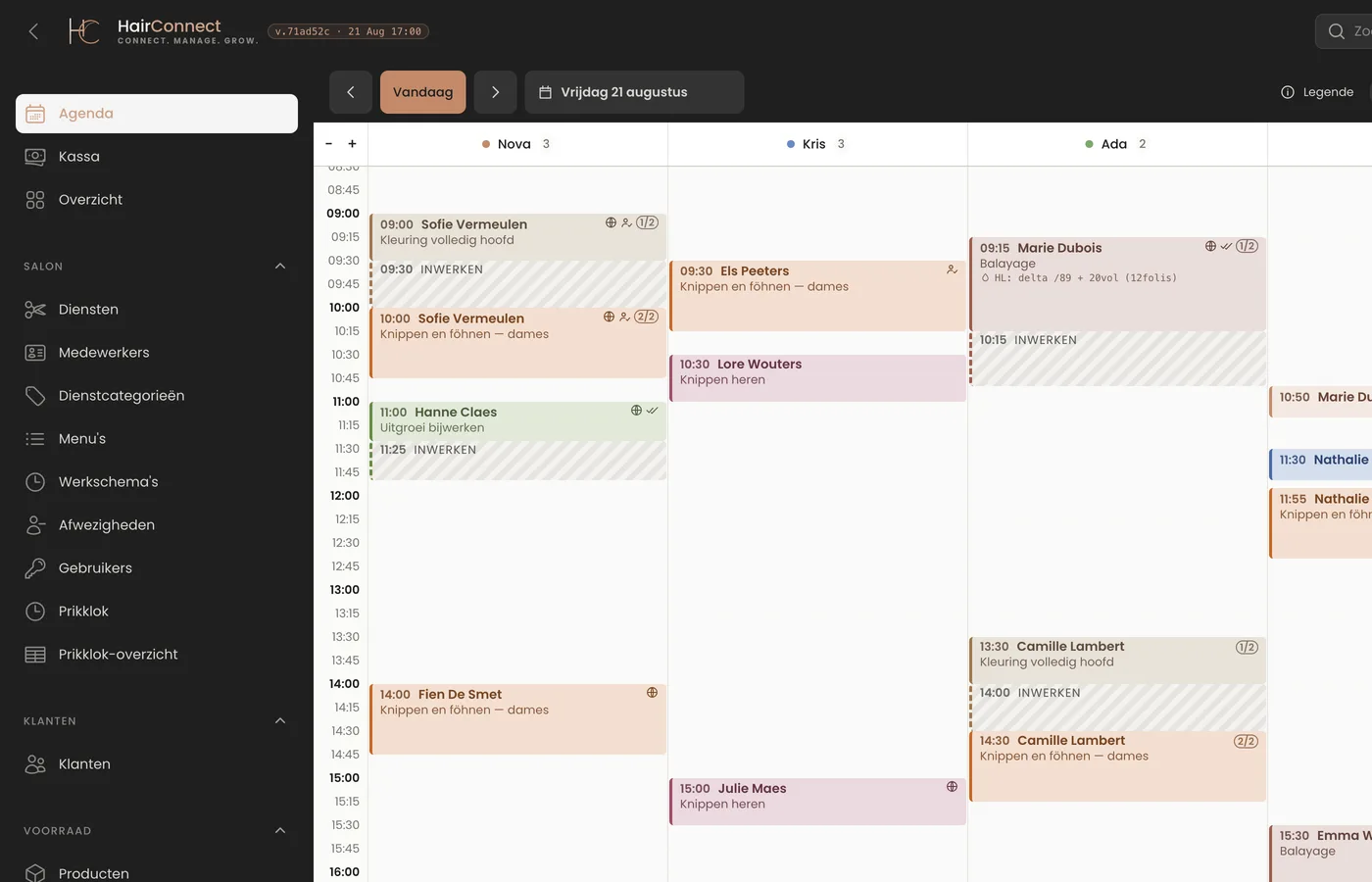 The day calendar in HairConnect with four columns: for a colour service the work block and the waiting block appear as two separate blocks below one another, and inside one client's waiting block sits another client's appointment with the same stylist.